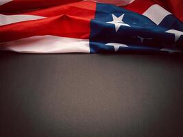 Part of the American flag is on a black background with copy space for text. Top view. photo