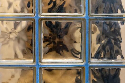 Intricate patterns created by light passing through decorative glass blocks in a modern architectural setting photo