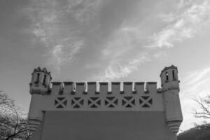 Exploring historic architecture with intricate designs against a cloudy sky at sunset photo