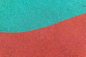 Vibrant colored sand design in a playground setting, showcasing contrasting textures and hues photo