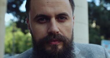 A closeup portrait of a distinguished bearded man engaging in deep and thoughtful reflection video