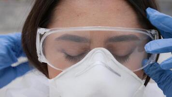 A young Arab woman, dressed in outdoor attire, adjusts her protective gear while enjoying a lively street atmosphere. She appears focused and ready for her next challenge. video