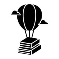 A solid design icon of parachute books vector