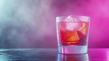 Amber Cocktail in Rocks Glass with Pink and Blue Background photo