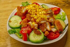 Crispy Chicken Salad with Corn and Fresh Vegetables photo