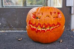 Scary Carved Pumpkin with Glowing Lights photo