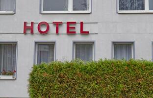 Hotel Building with Red Sign photo