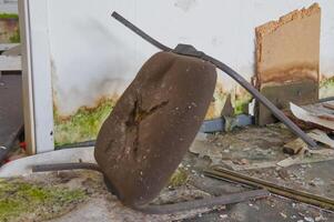 Abandoned Damaged Chair in a Dilapidated Room photo