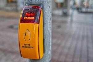 Pedestrian Traffic Signal Button in Urban Setting photo