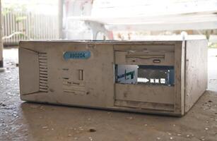Old Dusty Computer Case on Ground photo