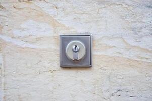Close-up of a Keyhole on a Stone Wall photo
