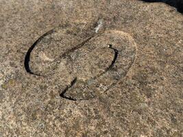 Intricate Carving on Weathered Stone photo