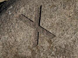 Carved Stone Cross Symbol X photo