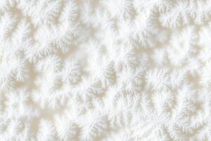 A close up of a white snowflake pattern photo