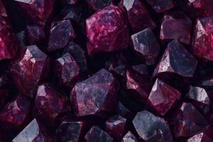 A large pile of red gems on a black background photo
