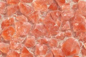A close up of a red stone surface photo