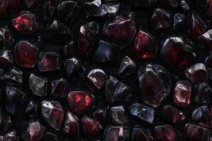 A black and red stone wall with many red stones photo