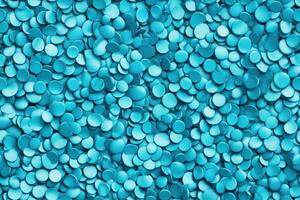 A large pile of blue plastic beads photo
