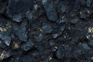 A black and gold texture with rocks and dirt photo