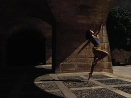 Anonymous ballet dancer performing on street photo