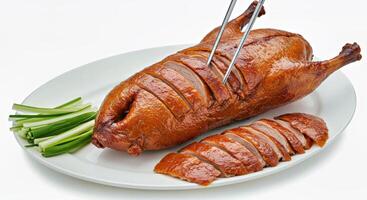 A plate with a chicken and two chopsticks photo