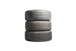 Three used tires stacked vertically, showcasing worn treads and slight discoloration. A perfect depiction of functionality and wear over time png