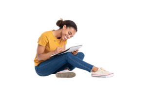 A bright and cheerful student, sitting cross-legged in a yellow top and jeans, leans forward while diligently taking notes in her notebook png