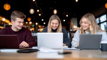 A group of students participating in a study group, discussing notes, with a laptop showing an online meeting photo