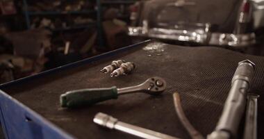 Tools and spark plugs on workbench video