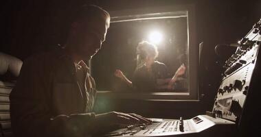 Record producer working near singer video