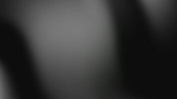 Blurry black and gray gradient background suitable for abstract designs, website banners, social media graphics, and digital art projects video
