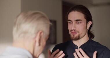 Son talking with father during visit video
