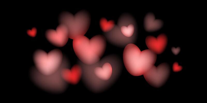Bokeh in heart shape festive background. Shine hearts, glitter and glow. Love romantic banner, background