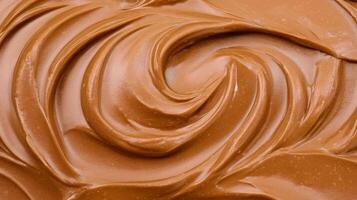 Creamy chocolate spread with smooth, swirled texture, perfect for desserts and snacks. Indulge in its rich flavor and velvety consistency photo