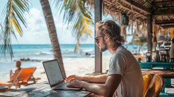 man working on laptop at beachside location, surrounded by palm trees and serene ocean view. scene captures relaxed and productive atmosphere photo