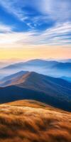 breathtaking landscape showcasing rolling hills and mountains under vibrant sky at sunset, with soft grass swaying in foreground photo