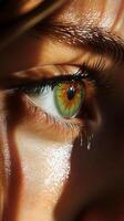 close up of human eye showcasing vibrant green and amber hues, with detailed eyelashes and skin texture illuminated by natural light, creating striking visual impact photo