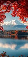 Majestic Mount Fuji reflected in serene lake, surrounded by vibrant autumn foliage. scene captures beauty of nature and tranquility photo
