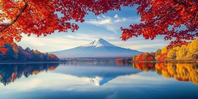 stunning view of Mount Fuji surrounded by vibrant autumn foliage reflecting in calm lake, creating serene and picturesque landscape photo