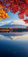 Mount Fuji reflected in serene lake, surrounded by vibrant autumn foliage. scene captures beauty of nature photo