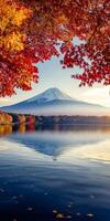 Mount Fuji reflected in serene lake, surrounded by vibrant autumn foliage. scene captures beauty photo