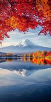 Majestic Mount Fuji reflected in serene lake, surrounded by vibrant autumn foliage. scene captures beauty of nature in tranquil photo