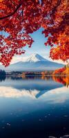 Majestic Mount Fuji reflected in serene lake, surrounded by vibrant autumn foliage. scene captures beauty of nature, evoking sense of tranquility and wonder photo