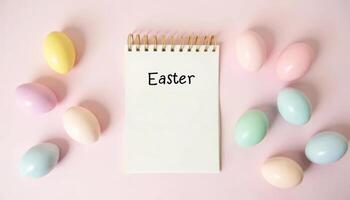 Spiral flip notebook with the inscription Easter with colorful eggs on a pastel background. photo