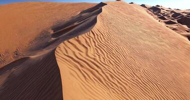 flying over a sand dune in a deserted desert video