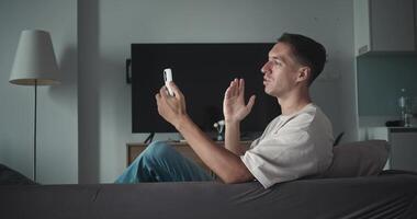 Man using smartphone for chat, bridging personal or professional connections, enabling instant communication, great for modern remote calling or social media clips. video