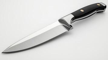 A sharp stainless steel chef's knife with a sleek black handle rests against a pure white background photo