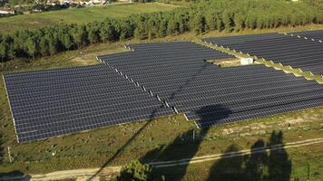 Aerial drone view of solar panels in fields blending green energy with nature video