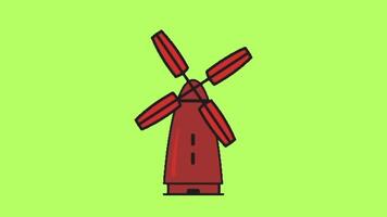 A red windmill on a green background video