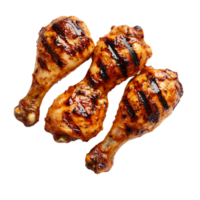 Grilled chicken drumsticks on a black surfaceisolated on transparent background png